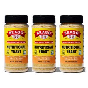 Three packs of vegan, gluten-free nutritional yeast cheese flakes.