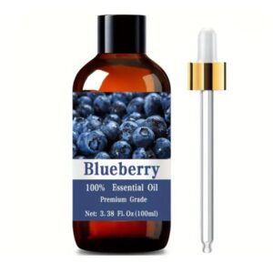 Blueberry Essential Oil 3.38fl.oz bottle displayed with blueberries and leaves in a spa-like setting.