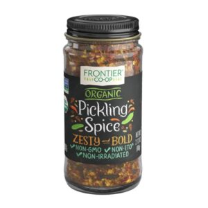 Frontier Organic Pickling Spice blend in a clear glass bowl showcasing its colorful and diverse spices.