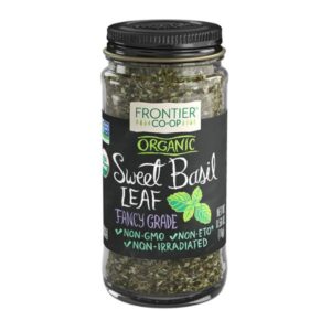 Front of the glass jar containing Frontier Co-op Organic Sweet Basil Leaf, Cut & Sifted