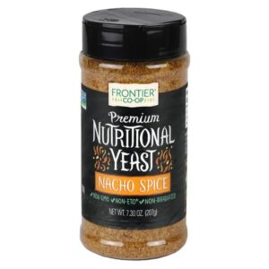 Front view of Frontier Co-op Nacho Spice Nutritional Yeast Blend jar with scoop shaker cap, showcasing the product label.