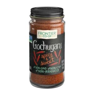 Front view of Frontier Co-op Gochugaru Korean-Style Chili Pepper in a glass bottle with a metal cap, showcasing the product label.