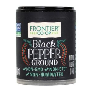 Front view of Frontier Co-op Medium Grind Black Pepper in packaging, highlighting its dustless texture and distinctive kick.