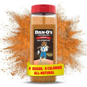A large 20 oz container of Dan-O's Spicy Seasoning, ideal for sugar-free cooking and grilling.