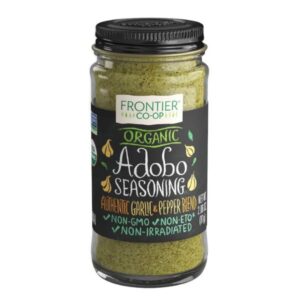 Front view of Frontier Co-op® Organic Adobo Seasoning 0.5Lb glass bottle with a metal cap.