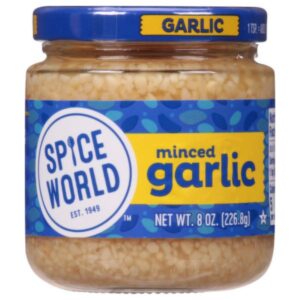 Front view of Spice World Minced Garlic 8oz jar, showcasing the brand label and fresh garlic.