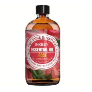 Bottle of Pure Rose Essential Oil 3.38oz with rose petals on a spa-like background.