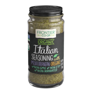 Organic Italian seasoning blend in a glass bottle with metal cap from Frontier Co-op, featuring oregano, thyme, basil, and other herbs.