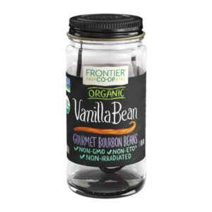 Whole organic vanilla beans in a glass bottle with a metal cap