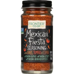 Salt-Free Mexican Fiesta Seasoning Blend by Frontier Co-op in a glass bottle with a metal cap, featuring vibrant label design.