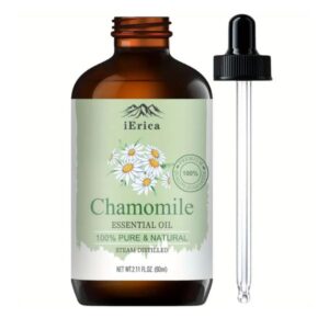 Bottle of Chamomile Essential Oil on a natural setting.