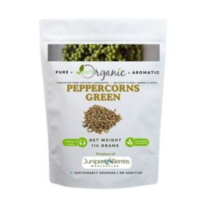 Whole green peppercorns in a glass jar, showcasing their fresh and vibrant color.