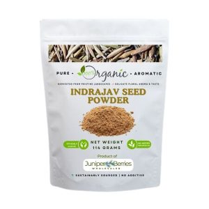 Organic Indrajav seed powder in glass jar with spoon